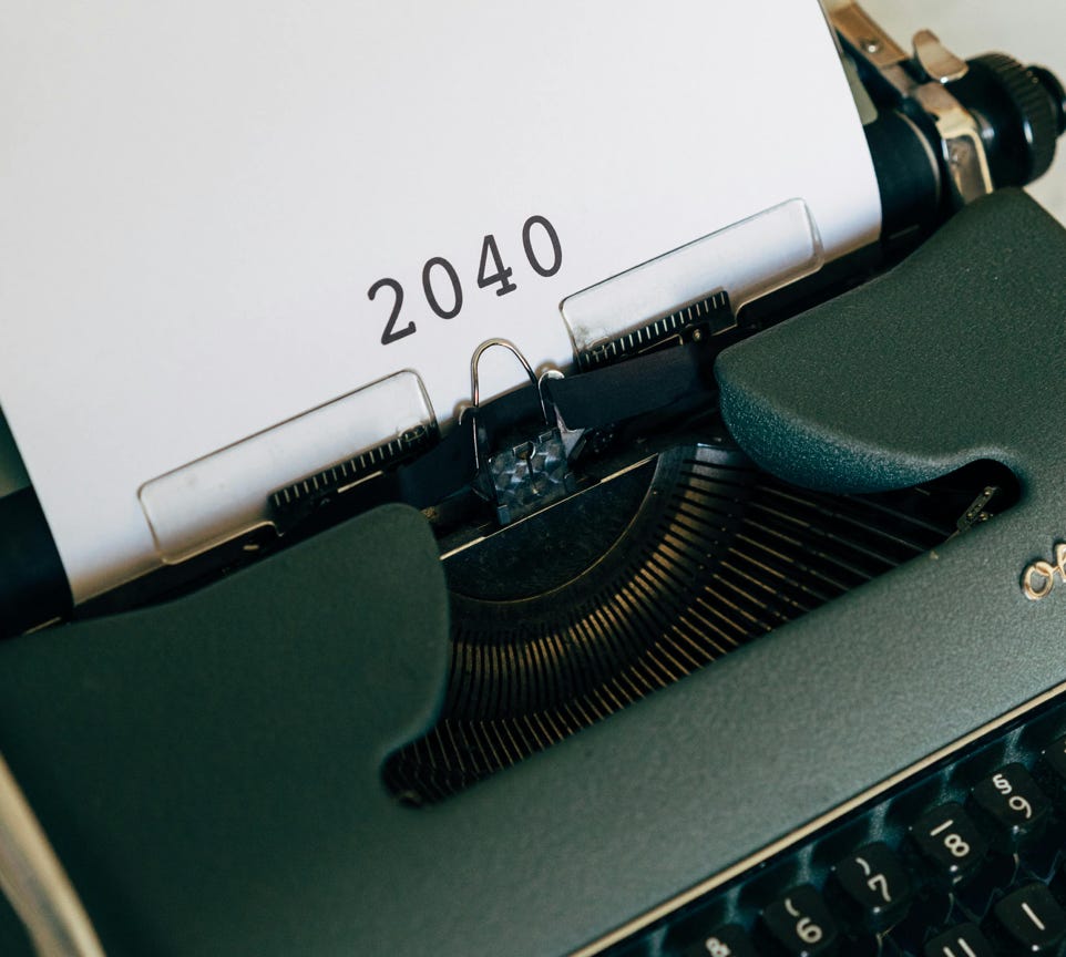 An Old Typewriter With 2040 Typed On Paper 